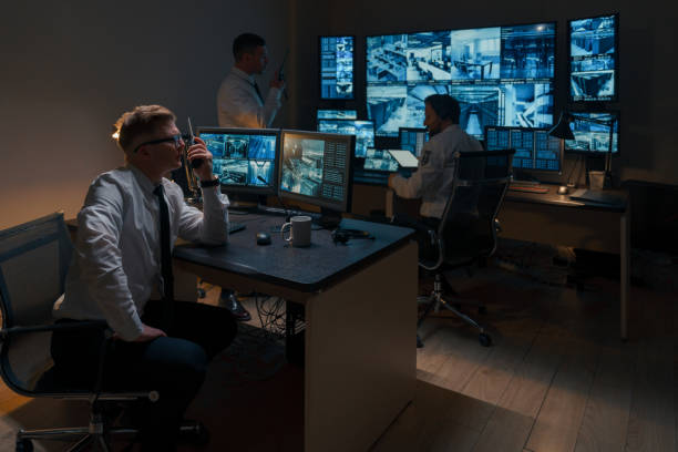 istock The general plan of the security room in which three employees are actively working. 1311088145