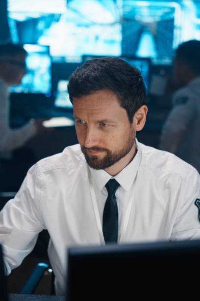 istock A man in the office at the workplace, which is equipped with monitors 1311088396