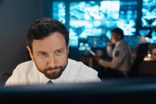 istock The security service operates around the clock. In their room of the central security management, security officers conduct constant monitoring of order and security. 1311088448