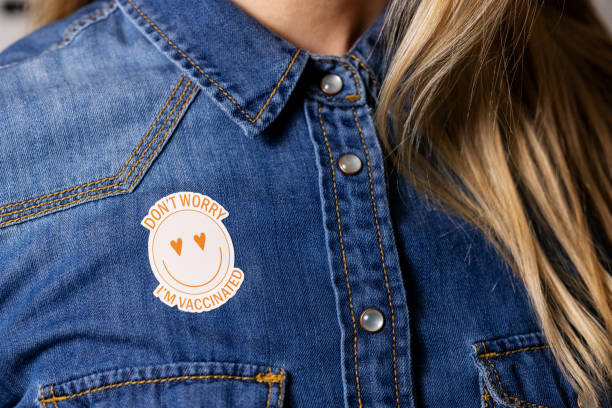 istock vaccinated person with immunity identification label on the shirt 1311091148