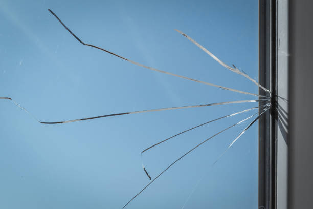 istock Cracked window glass pane 1311091297