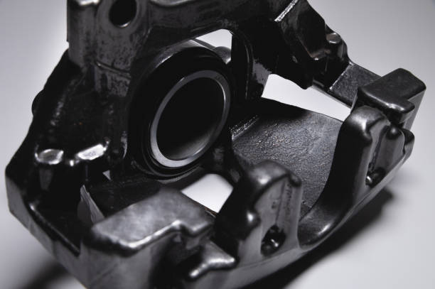 istock Refurbished and reassembled disc brake caliper on gray background 1311094379