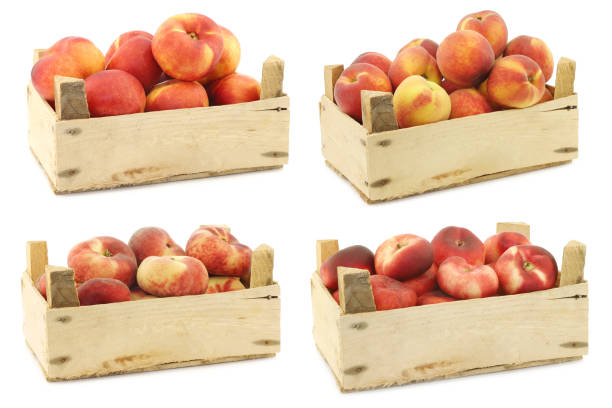 istock Fresh peaches and flat peaches (donut peaches) in a wooden crate 1311094487