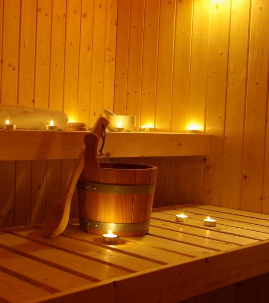 sauna com luzes de madeira e chá - tea light candle relaxation lifestyles - fotografias e filmes do acervo