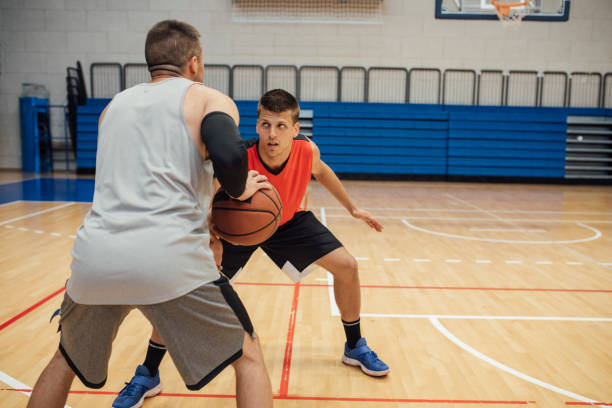istock A Game of Hoops: Two Young Men Playing Basketball One-on-One 1311096929