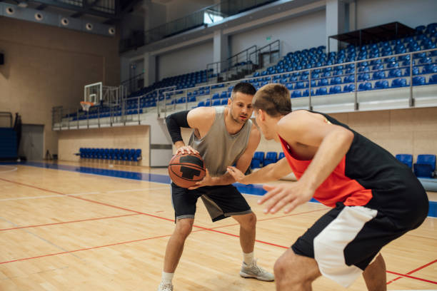 istock A Game of Hoops: Two Young Men Playing Basketball One-on-One 1311096932