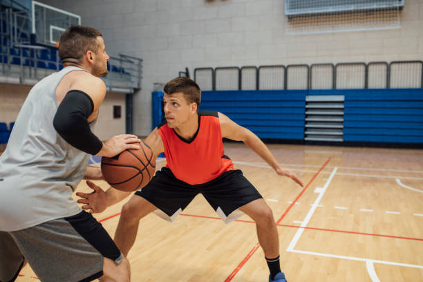 istock A Game of Hoops: Two Young Men Playing Basketball One-on-One 1311096948