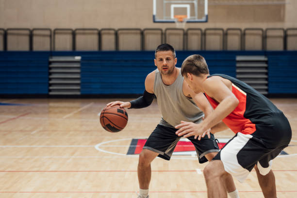 istock A Game of Hoops: Two Young Men Playing Basketball One-on-One 1311096969