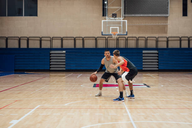 istock A Game of Hoops: Two Young Men Playing Basketball One-on-One 1311096976