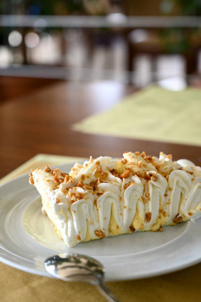 istock Selective focus of cake with cream in a plate in restaurant 1311097076