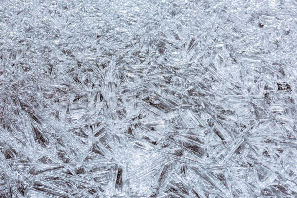 istock The texture of the thin ice on the water surface 1311097647