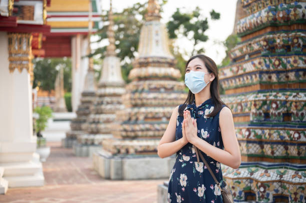 istock Social distancing traveling wear facemask before entry landmark 1311098480