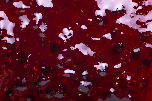 Bilberry And Raspberry Jelly jam texture background close up.