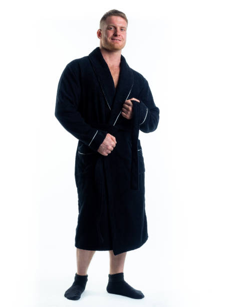 istock strong man in a Bathrobe on an isolated white background with a smile on his face. 1311099578