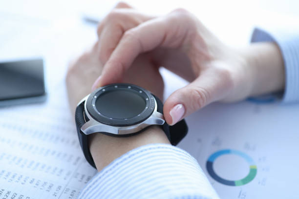istock Smart watch with black bracelet on woman's hand 1311102077