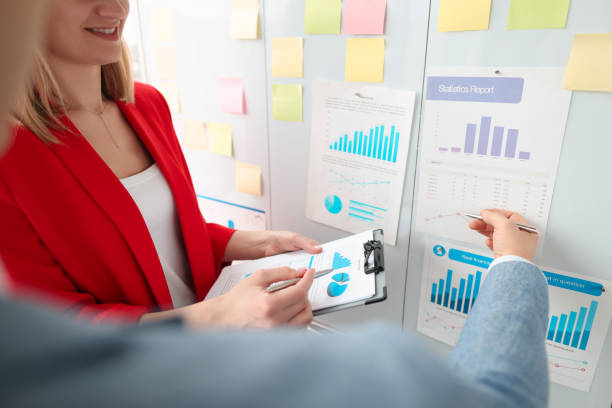istock Business people are discussing business figures in graphs on blackboard 1311102081