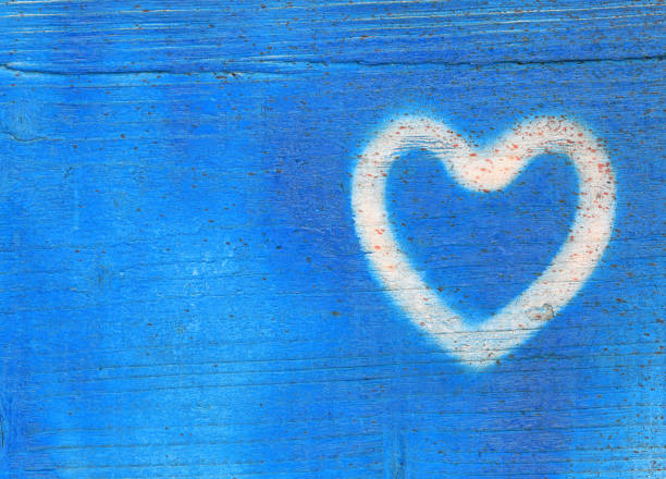 istock blue heart on blue wooden background 1311102322