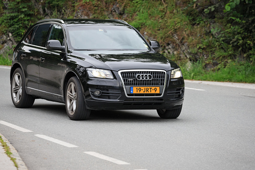 Finkenberg, Schwaz, Tyrol, Austria, august 10th 2016, a Dutch 2009 black first generation Audi Q5 (2.0 TFSI quattro) SUV approaching on a mountain road - the Tyrol state in Austria is a popular travel destinations for the Dutch people to spend their vacation