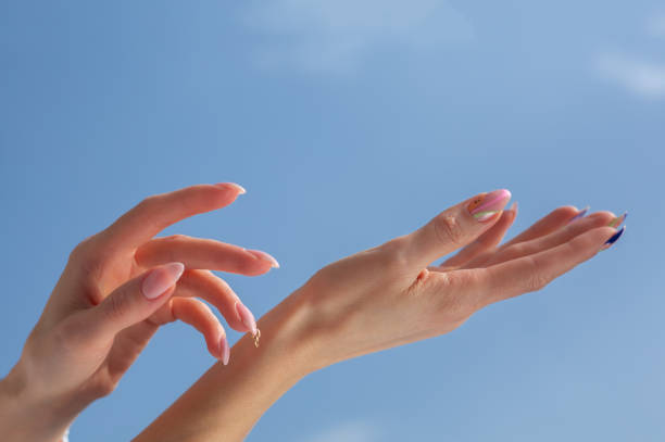 istock Beautiful female hands with manicure on a blue background 1311105021