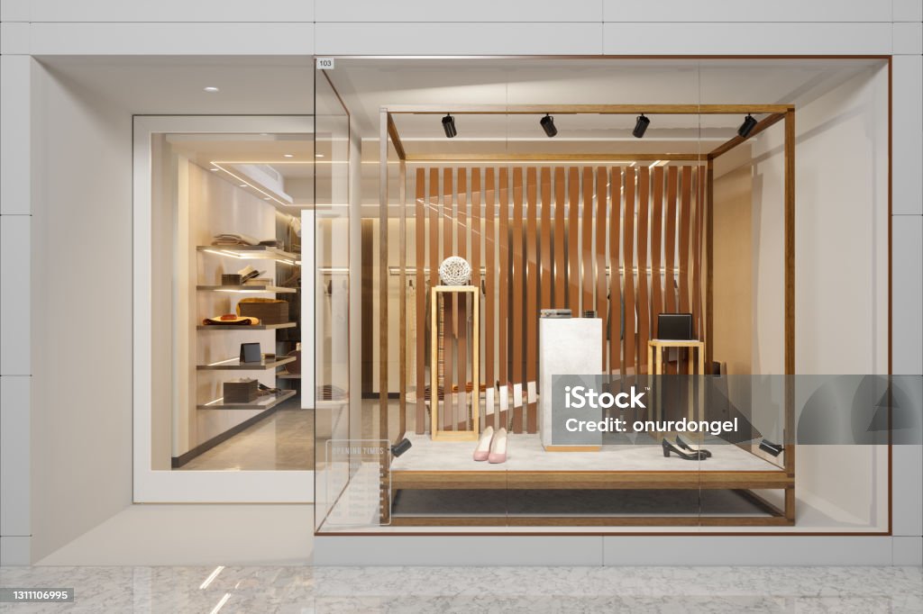 Exterior Of Clothing Store With Shoes And Other Accessories Displaying In Showcase Store Stock Photo