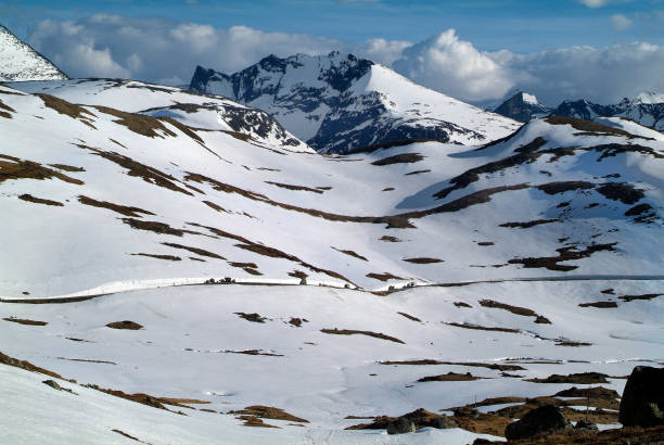 Norway, snow covered landscape and cleared mountain road over the Sognefjell pass in late spring