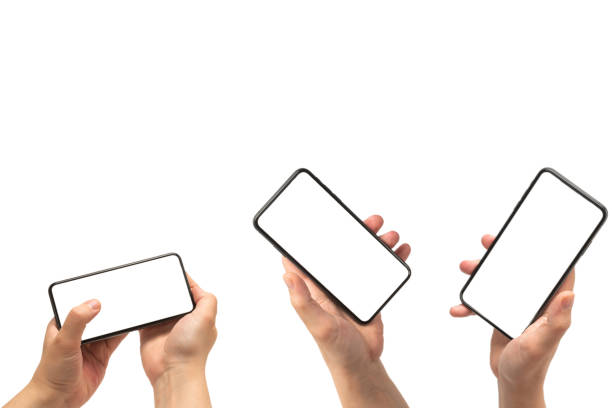 istock Smart phone in man hand isolated on white background.  White screen. 1311108291
