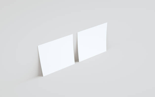 istock Square Flyer Mock-Up - Two Flyers Against Wall Background 1311108292