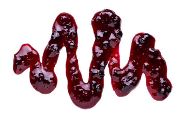 istock Bilberry And Raspberry Jelly jam splash isolated on white background 1311108444