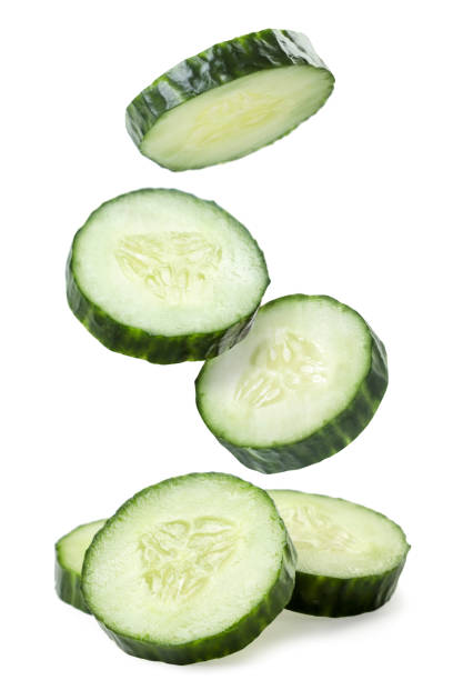 istock Cucumber slices fall on a white background. Isolated 1311109643