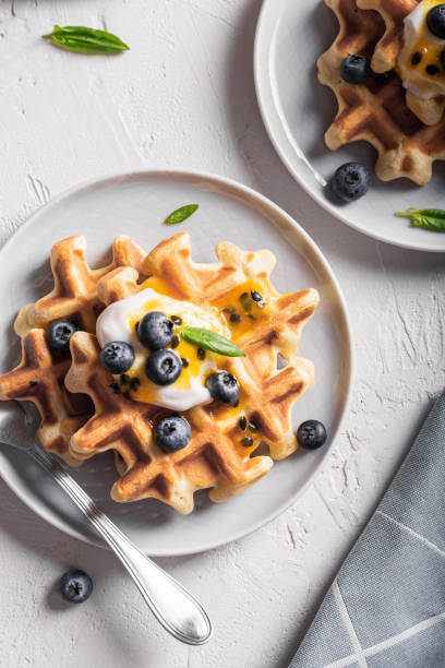 istock Breakfast with waffles with blueberries on a plates 1311109976