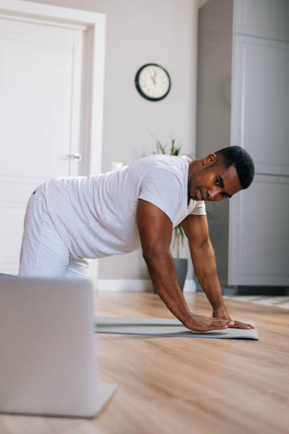 istock Strong African-American man have online training talking and using laptop remote communication 1311110576