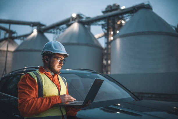 istock Serious handsome engineer using a technology while working in the oil and gas industry. 1311110729