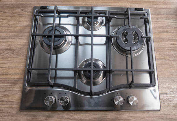 istock Silver pan on a modern silver gas stove in the kitchen close-up. 1311111219