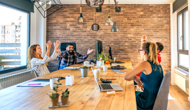 istock Businesspeople celebrating a success in office 1311115408