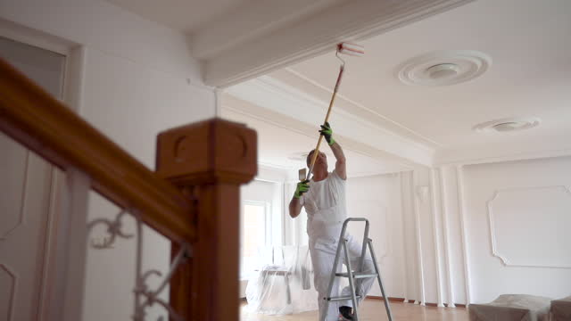 Painter painting a ceiling