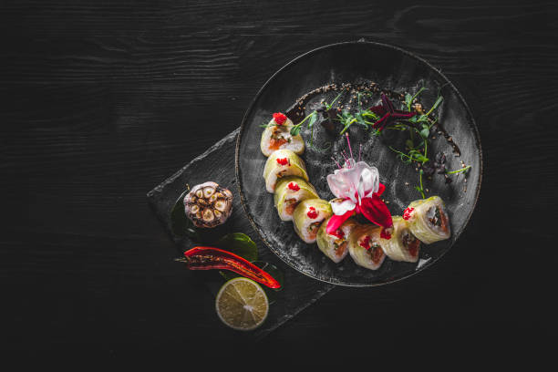 istock sushi roll in plate on wooden table background 1311117267