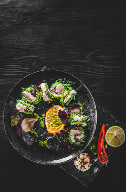 istock sushi roll in plate on wooden table background 1311117834