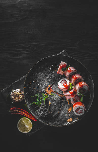 istock sushi roll in plate on wooden table background 1311117844