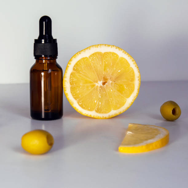istock Serum bottle, lemon and olives on white background 1311118047