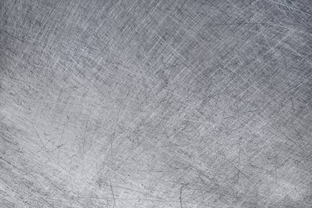 istock aluminium texture background, scratches on stainless steel. 1311118073