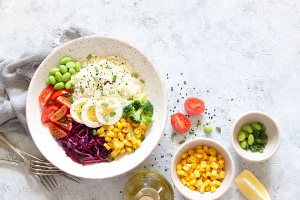 istock Rice salad with vegetables and sesame on light background. 1311118171