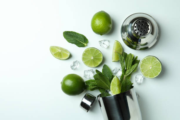 istock Cocktail shaker and ingredients for mojito on white background 1311119269