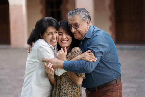 istock Happy family with one daughter embracing 1311119480