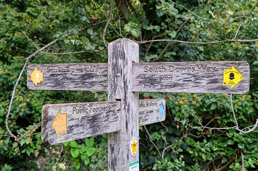 Close-up of a pubic footpath sign post on the on the South Downs way in East Sussex