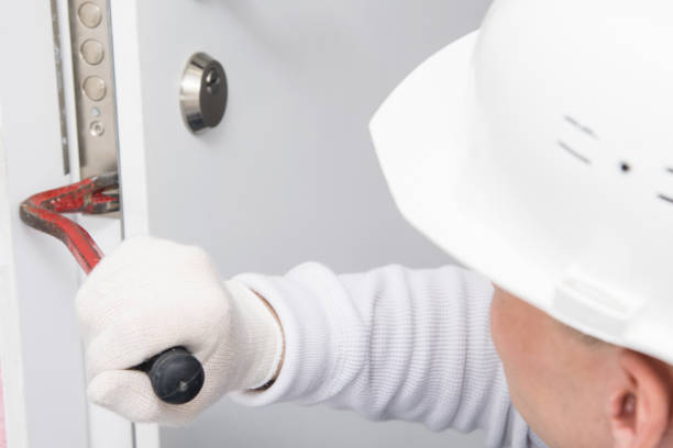 istock after breaking the lock, the dismantled door is tried to open with a special tool for hacking, close-up 1311119549