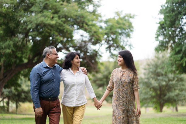 istock Latin family with one daughter walking outside 1311119663