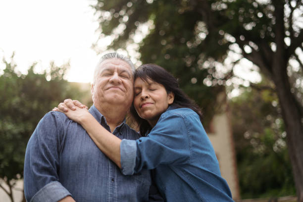 istock Mature couple embracing with eyes closed 1311120030
