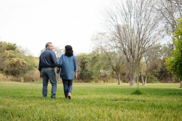 istock Mature couple walking together on nature 1311120114