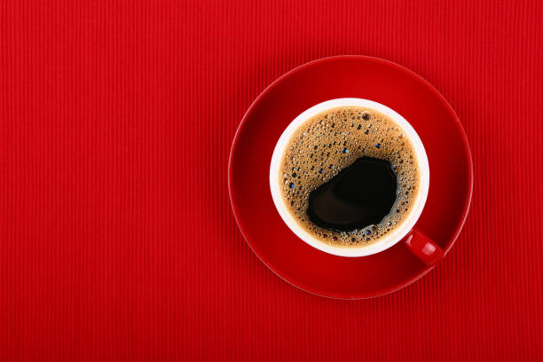 istock Cup of black instant coffee on red saucer 1311123654