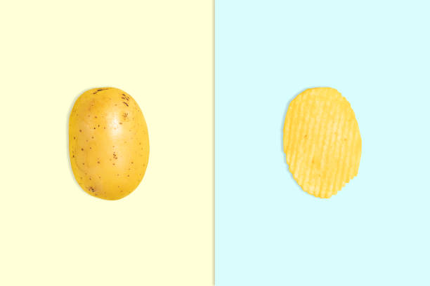 istock Raw early potato tuber on yellow background and rippled crispy potato chips on blue background 1311124231
